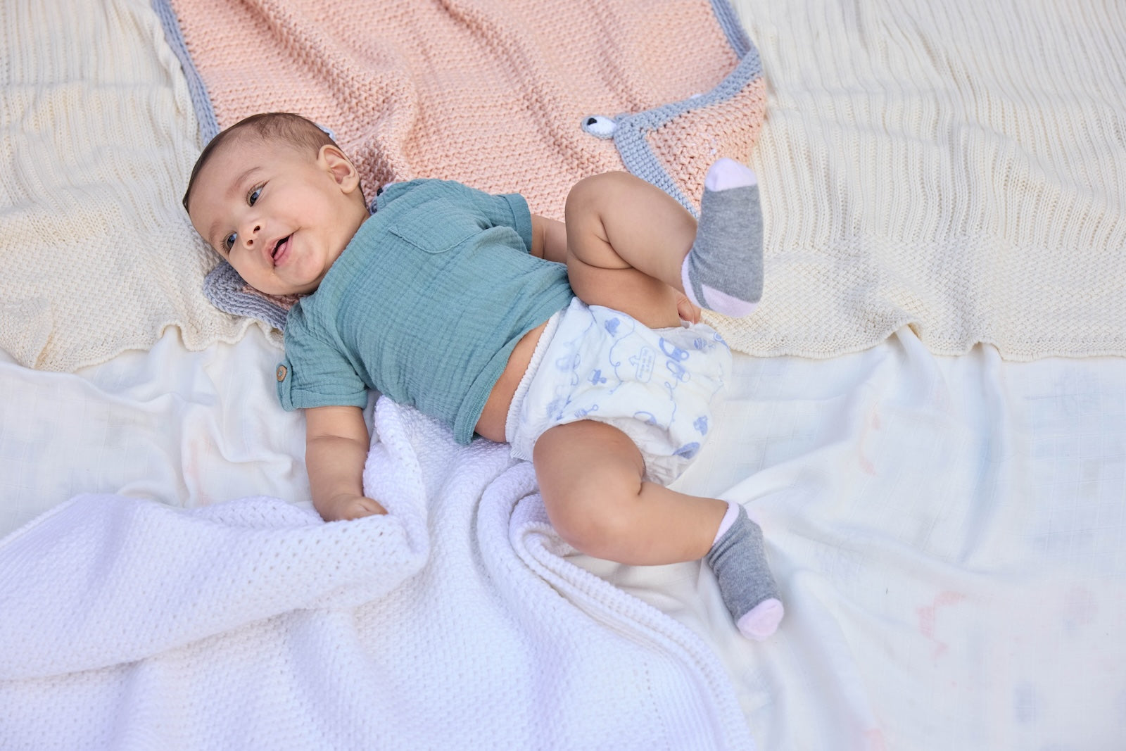 Baby in Pokito Baby Pants playing on the ground - Pokito Baby